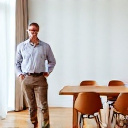 Michael T. standing by his Modern Furniture Design dining table